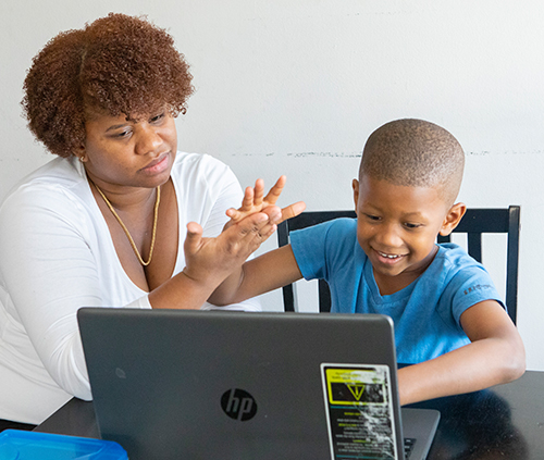mom and son using the computer
