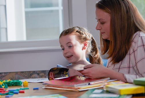 Mother and daughter doing homework together